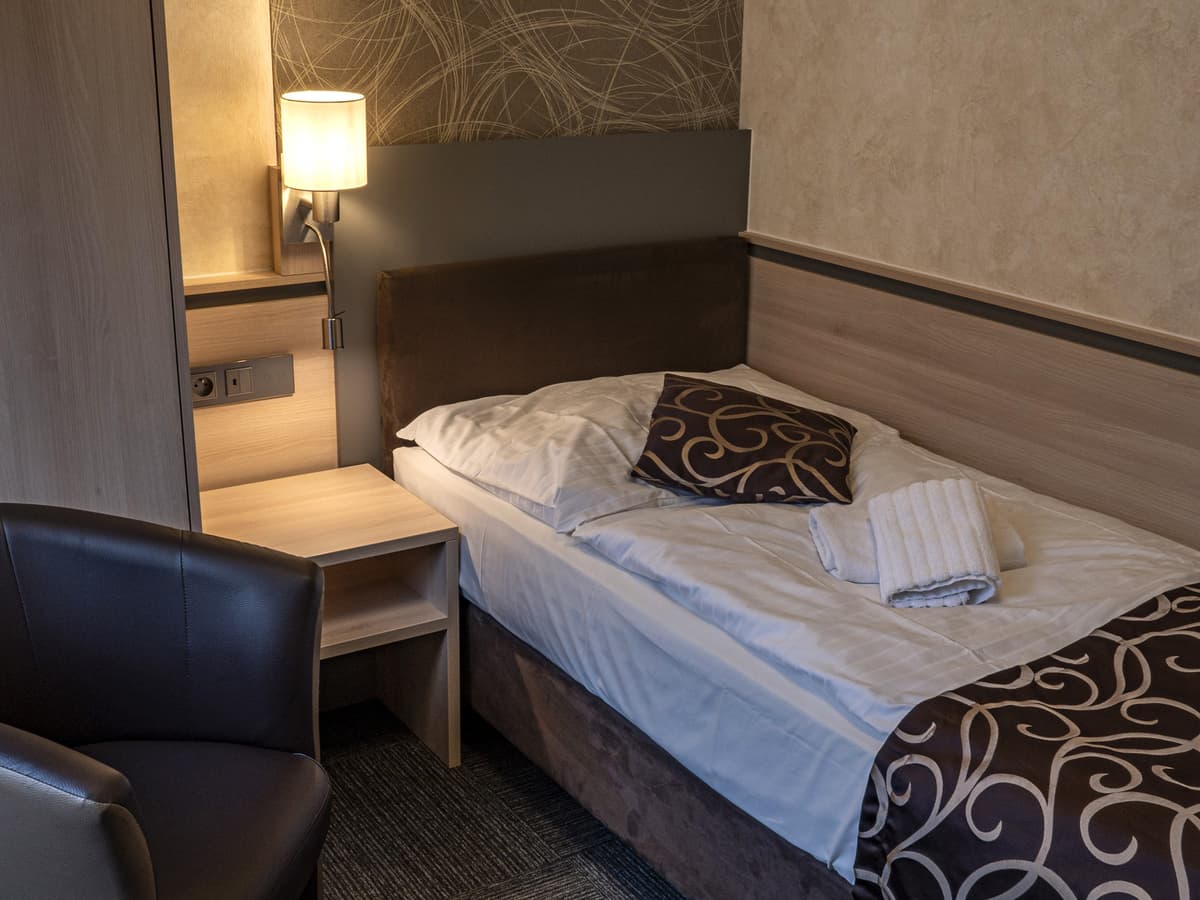 Single room with modern lamp and desk