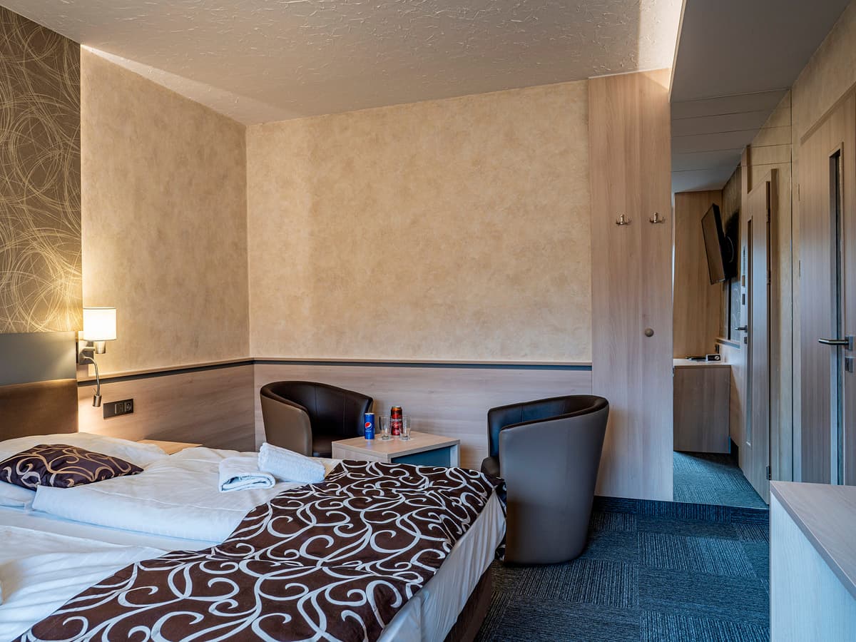 Full view of a room with twin beds and seating area