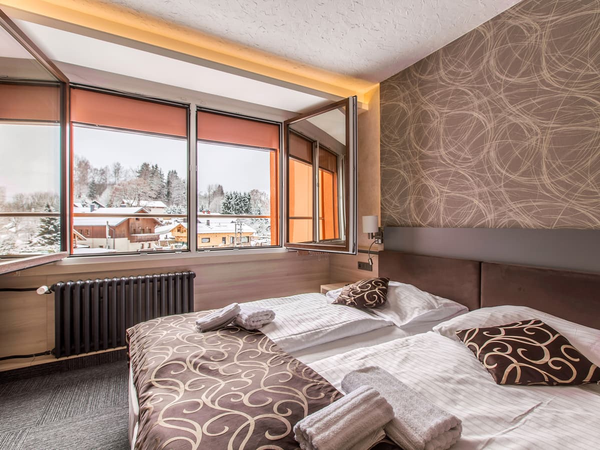 Double room with armchair and scenic view