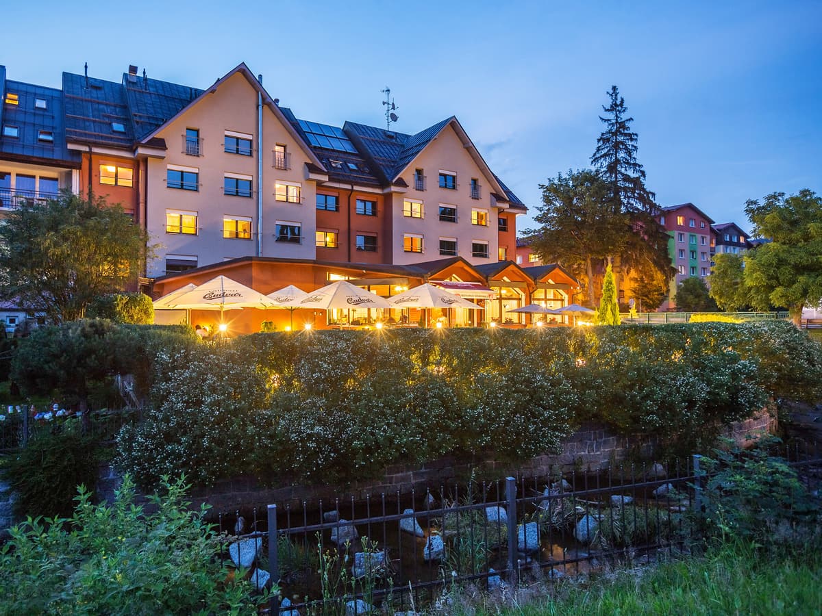 Terrace and river in front of the pension in the evening